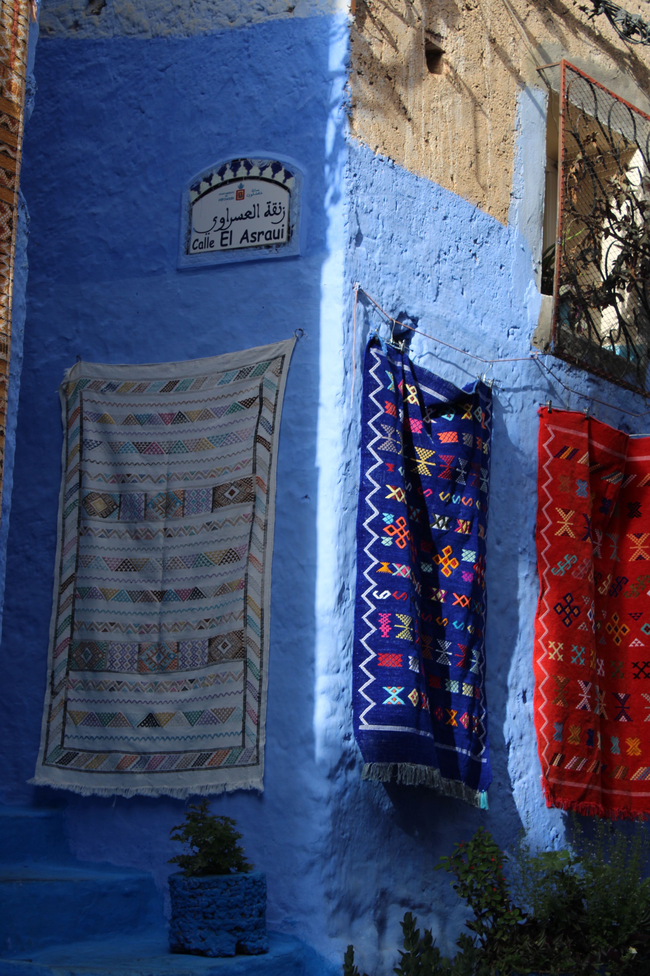 Colorful Rugs Hanging in Chefchaouen Alley · Free Stock Photo