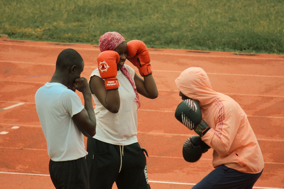 Young Athletes Engaged in Boxing Training Outdoors · Free Stock Photo