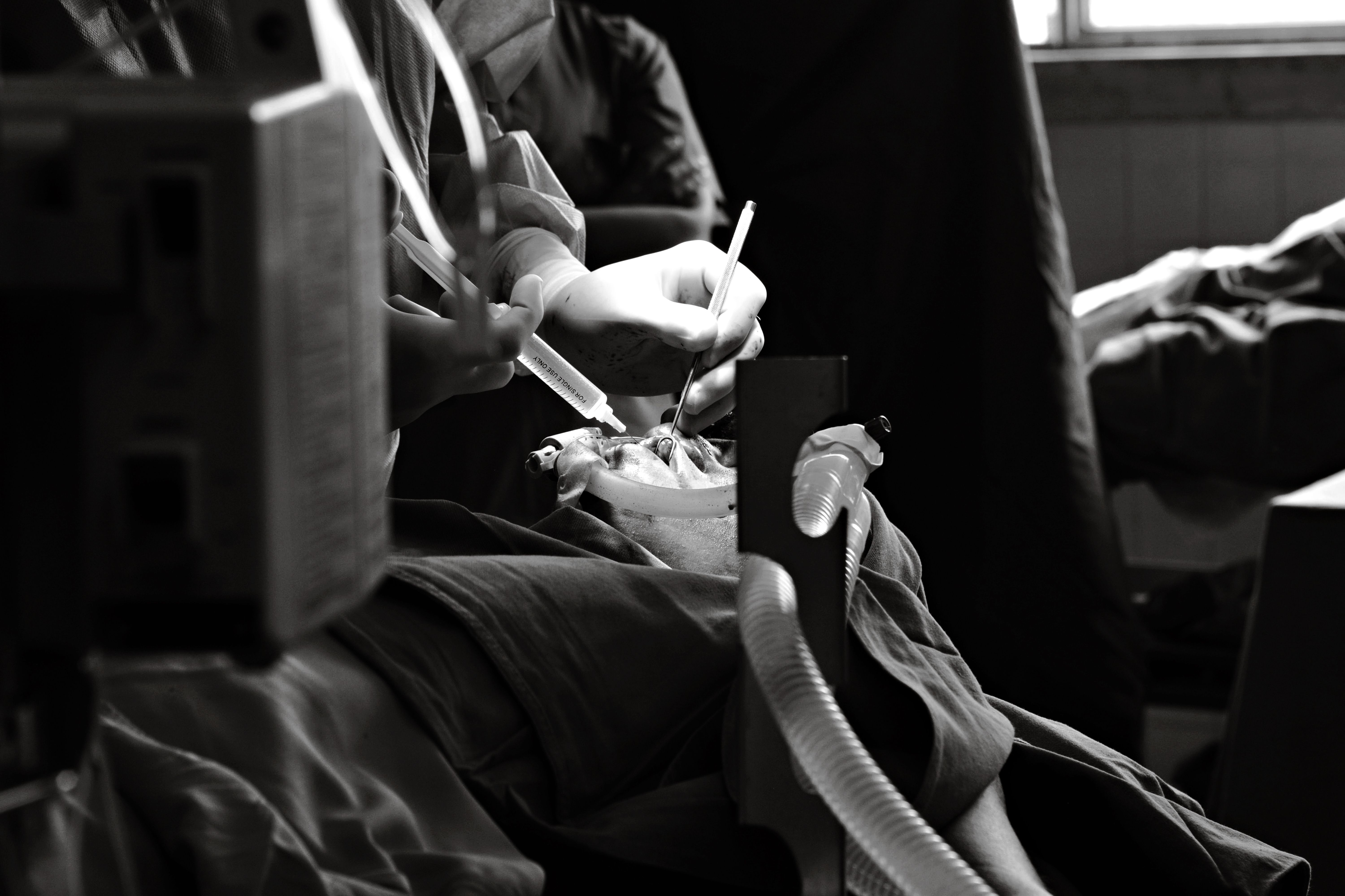 Grayscale Photo of a Woman Lying on Hospital Bed · Free Stock Photo