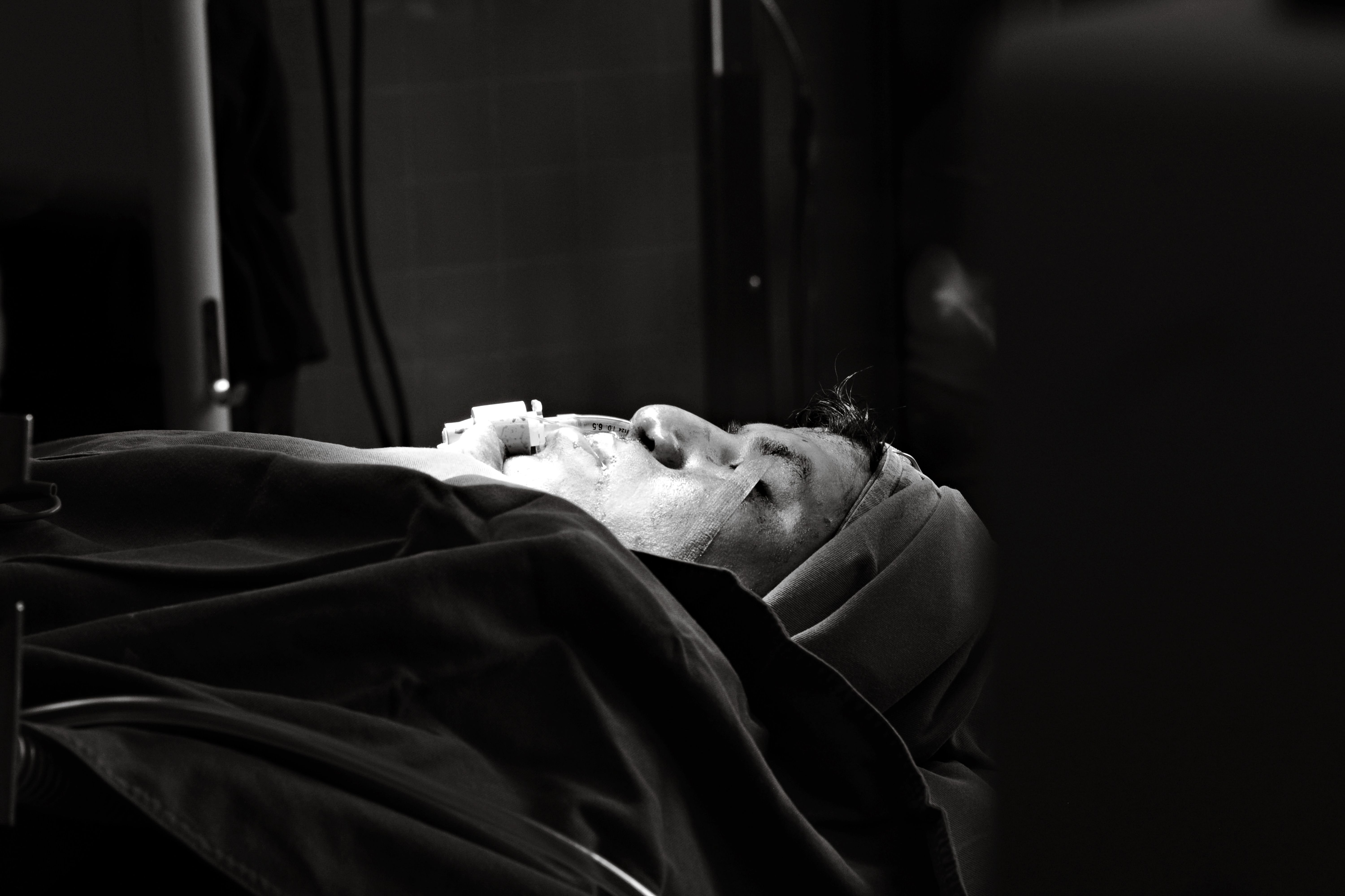 Grayscale Photo of a Woman Lying on Hospital Bed · Free Stock Photo