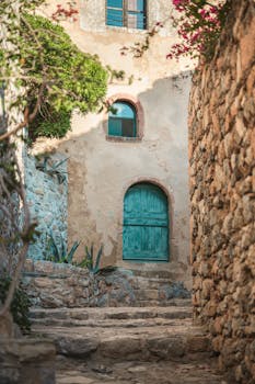 Explore the rustic charm of Monemvasia with this scenic stone pathway showcasing its unique architecture.