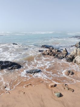 Beautiful coastal scene in Casablanca with waves crashing on rocky shoreline, perfect for travel and nature themes.