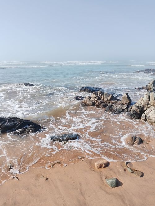 Free Beautiful coastal scene in Casablanca with waves crashing on rocky shoreline, perfect for travel and nature themes. Stock Photo