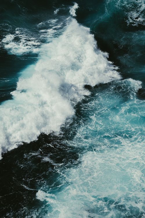 Free A stunning view of powerful waves crashing on the rocky coast of County Clare, Ireland. Stock Photo