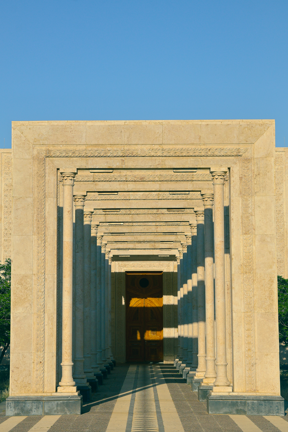 Symmetrical Architectural Stone Columns in Sunlight · Free Stock Photo