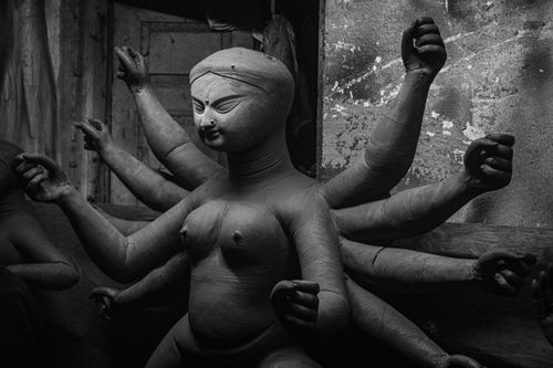 Free Artisans sculpting a clay statue of Goddess Durga in Kolkata for Durga Puja festival. Stock Photo