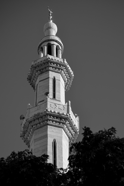 Free Black and white photo of a detailed minaret against a clear sky. Stock Photo