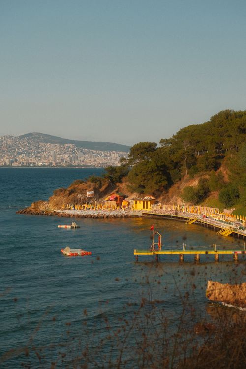 Free Enjoy the warm sunset hues over Heybeliada's coastline with scenic views and inviting beaches. Stock Photo