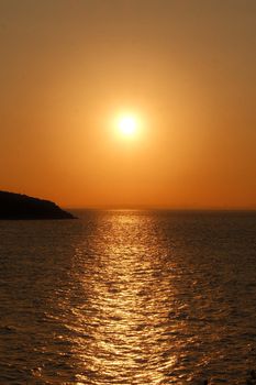 Golden sunset over the sea at Heybeliada, Istanbul, creating a warm ambiance.