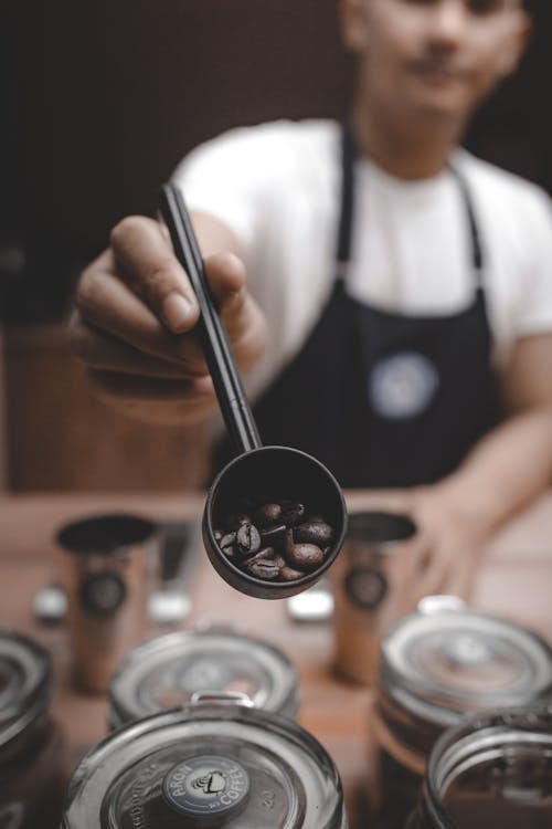 Free Man Holding Ladle With Coffeebean Stock Photo