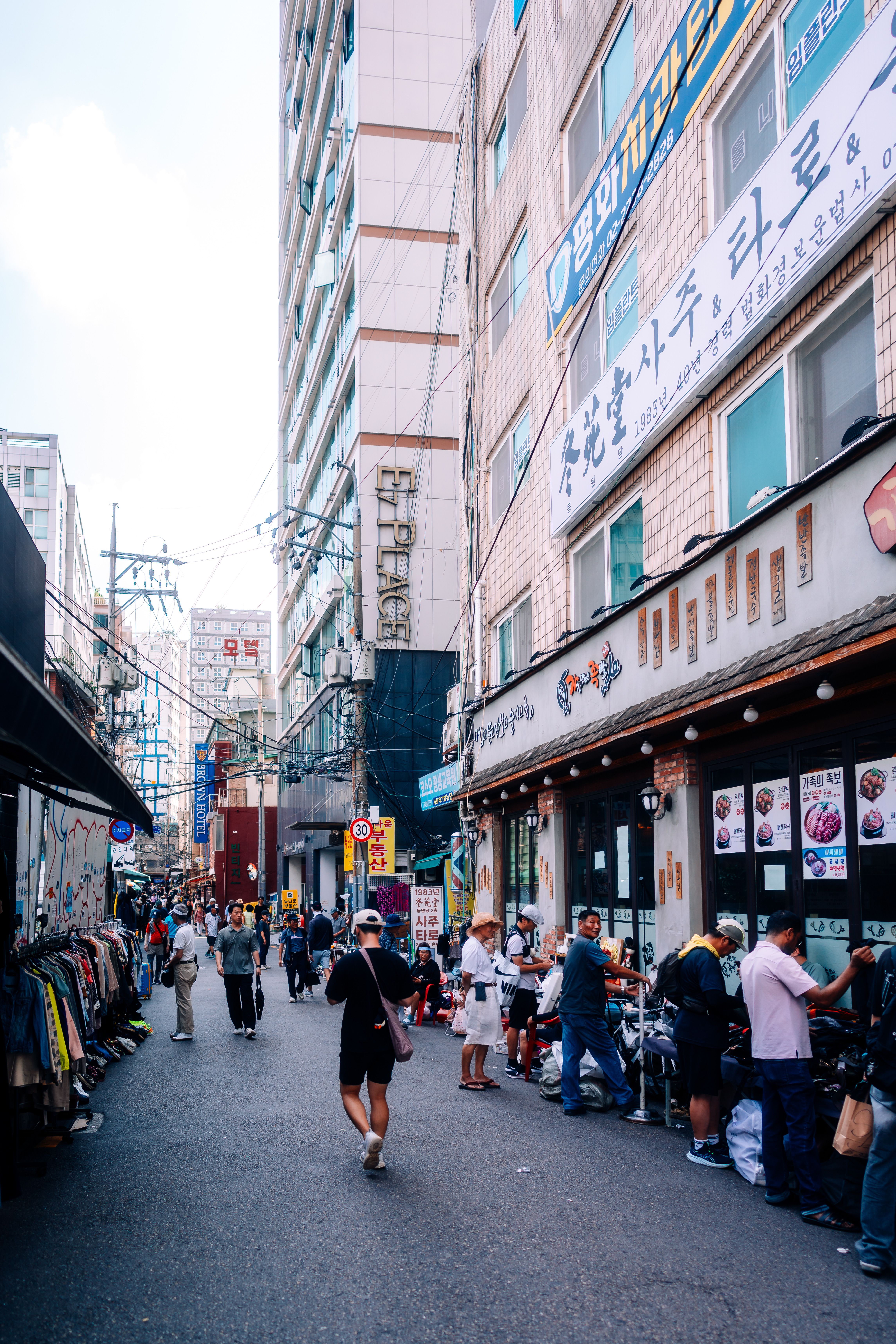Lively Seoul street capturing bustling urban life, local shops, and vibrant culture.