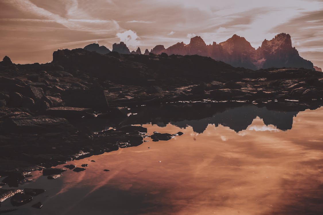 Gray Mountains Near Body of Water