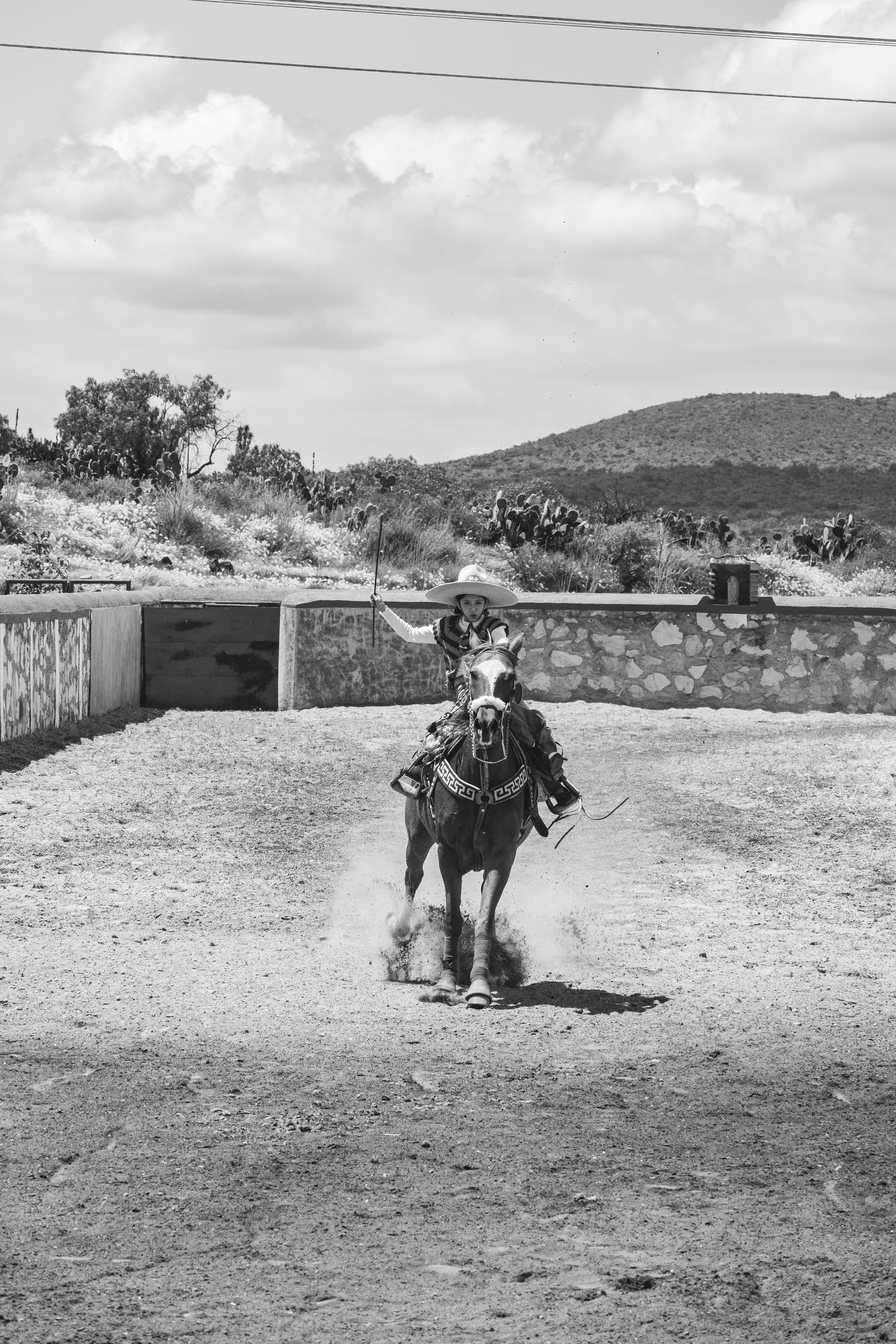 A stunning black-and-white capture of a horse rider in San Juan Tizahuapan, Mexico.
