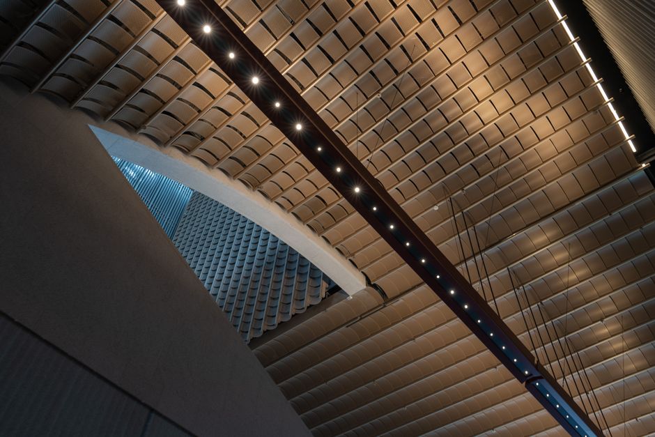 Sculptural coffered and dimensional ceiling panels in an open-concept interior Sculptural coffered and dimensional ceiling panels in an open-concept interior
