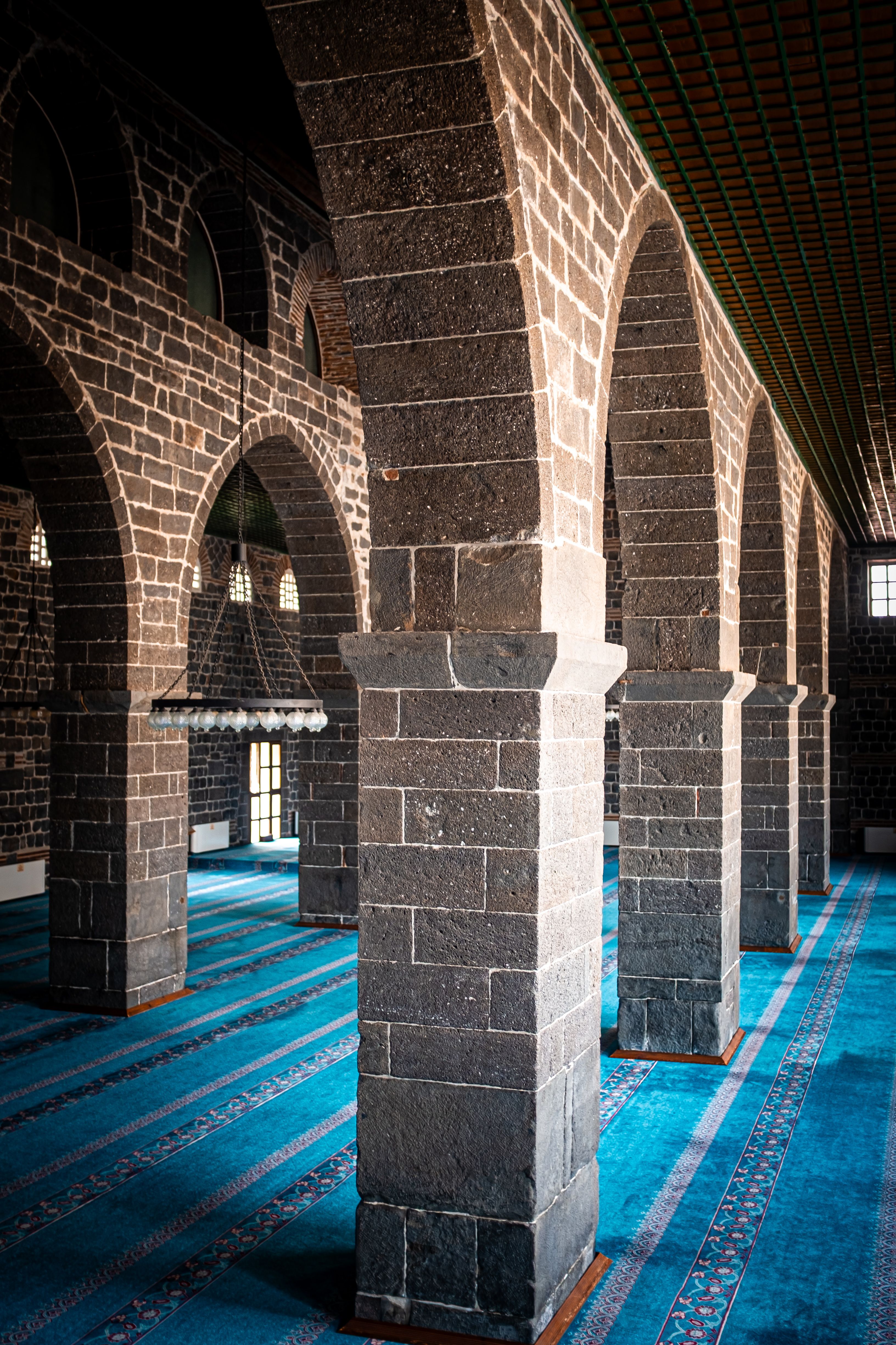 Historic Mosque Interior with Arched Columns · Free Stock Photo