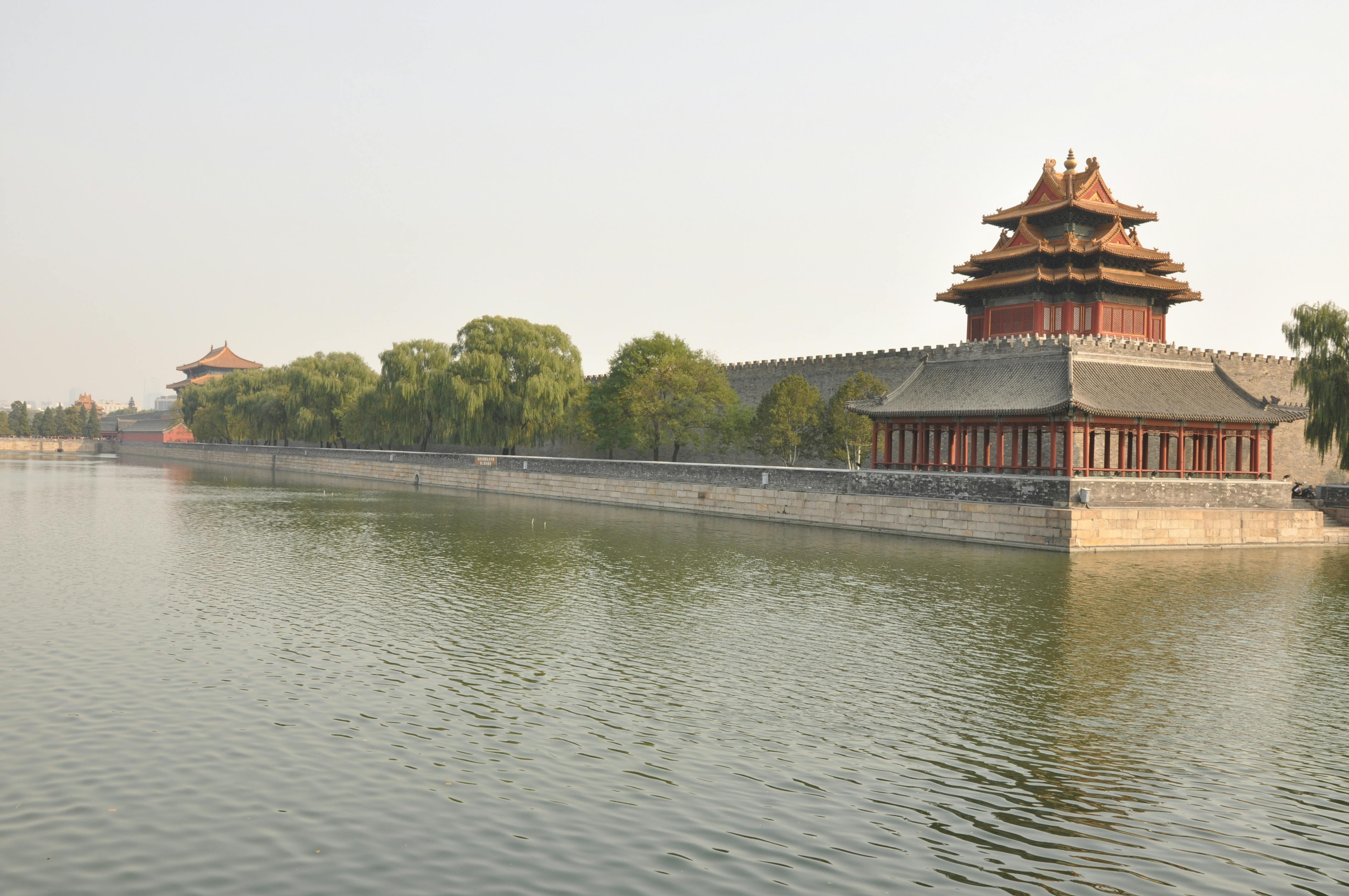 Serene image of the Forbidden City showing traditional architecture and water reflection in Beijing.