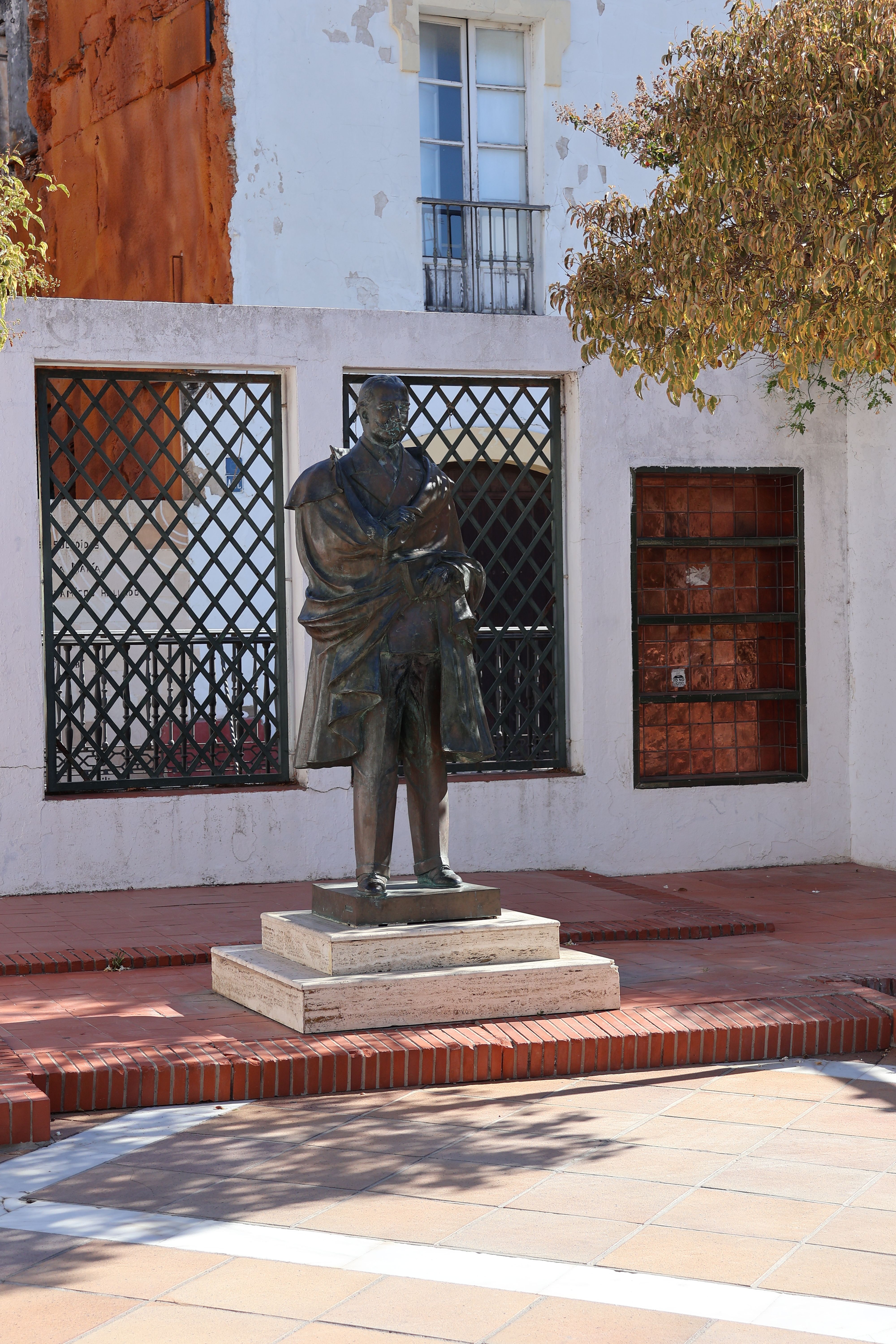 Bronze statue in a sunny plaza, El Puerto de Santa María, Spain.