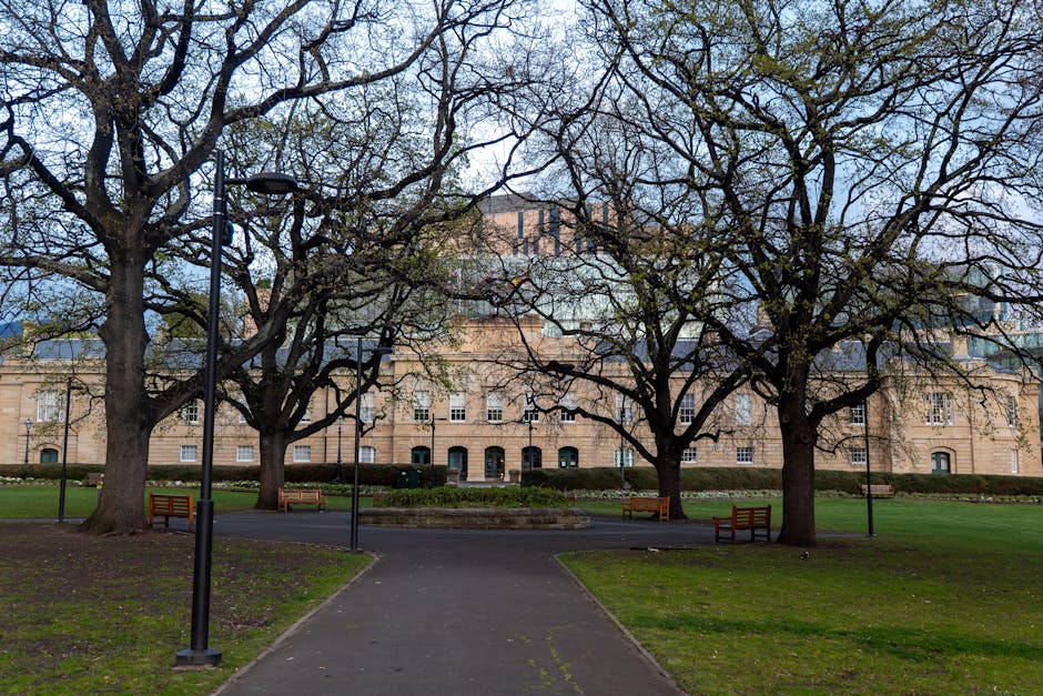 Serene park scene with historic building and trees in Hobart, Tasmania.