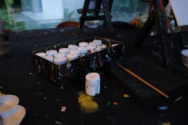 Artistic paint supplies on creative workspace