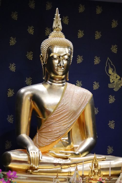Free A stunning golden Buddha in a Boston temple, adorned with intricate details. Stock Photo