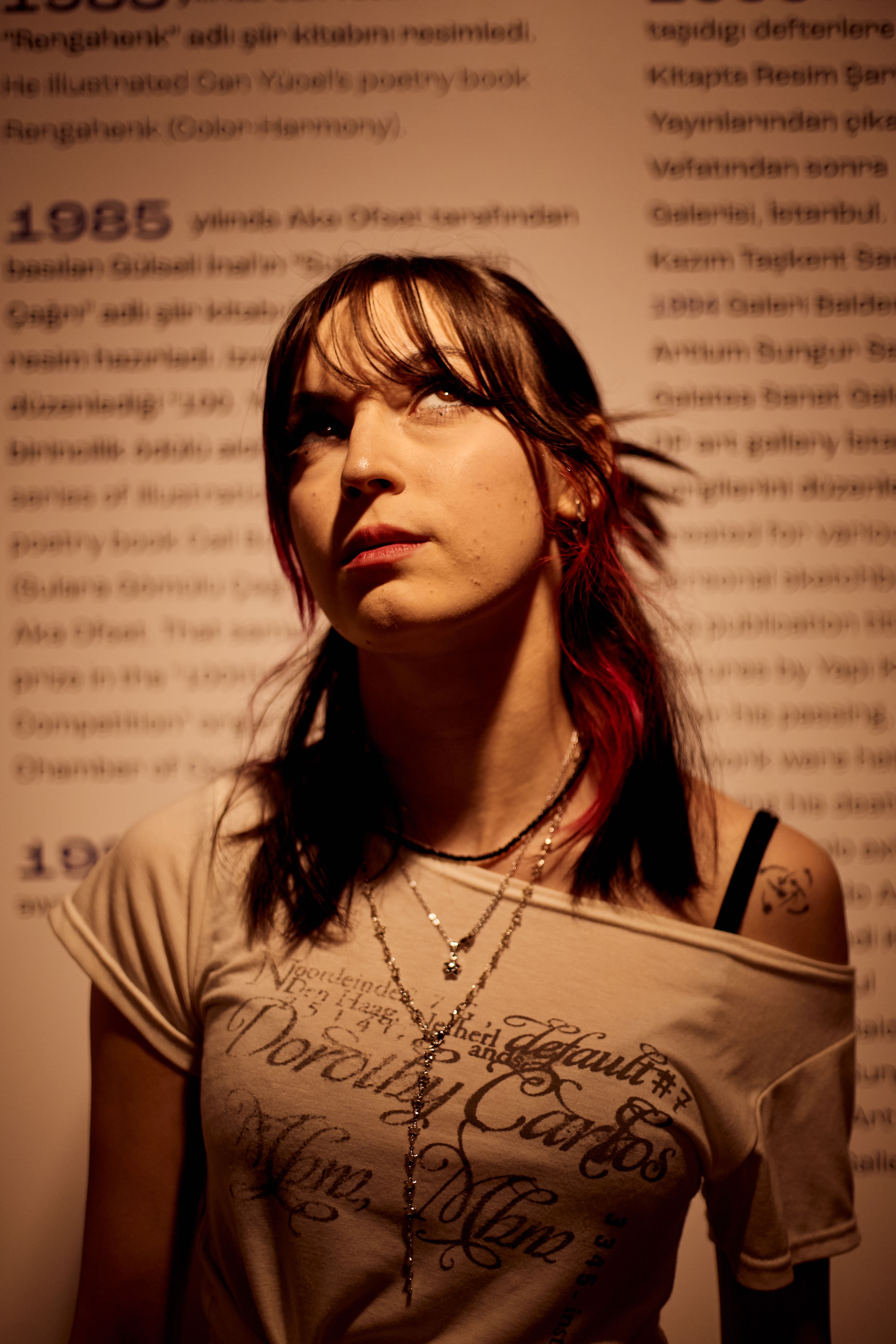 Portrait of a young woman looking contemplative inside a museum exhibit in Istanbul, Turkey.