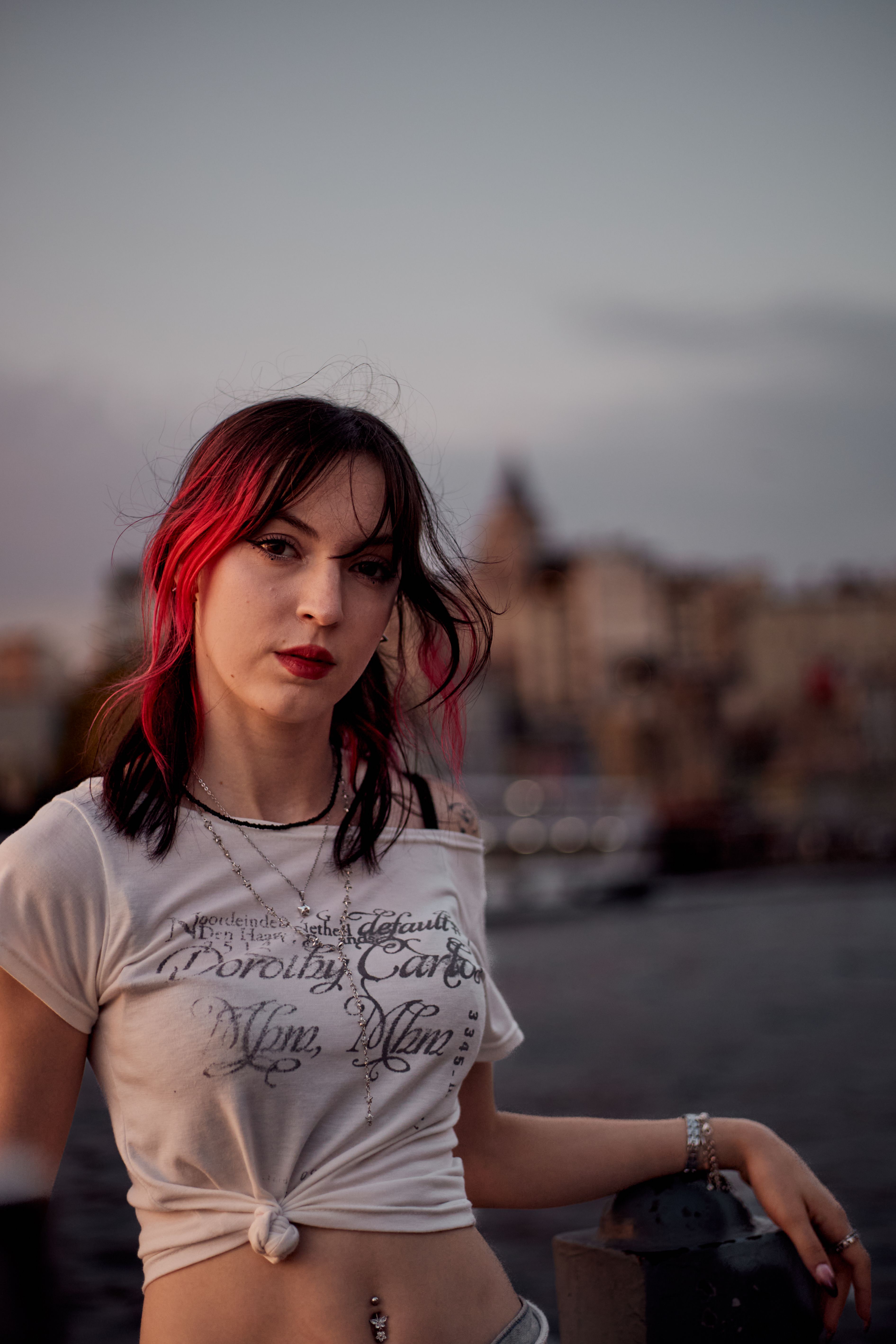 Young Woman Posing by Golden Horn at Sunset in Istanbul · Free Stock Photo