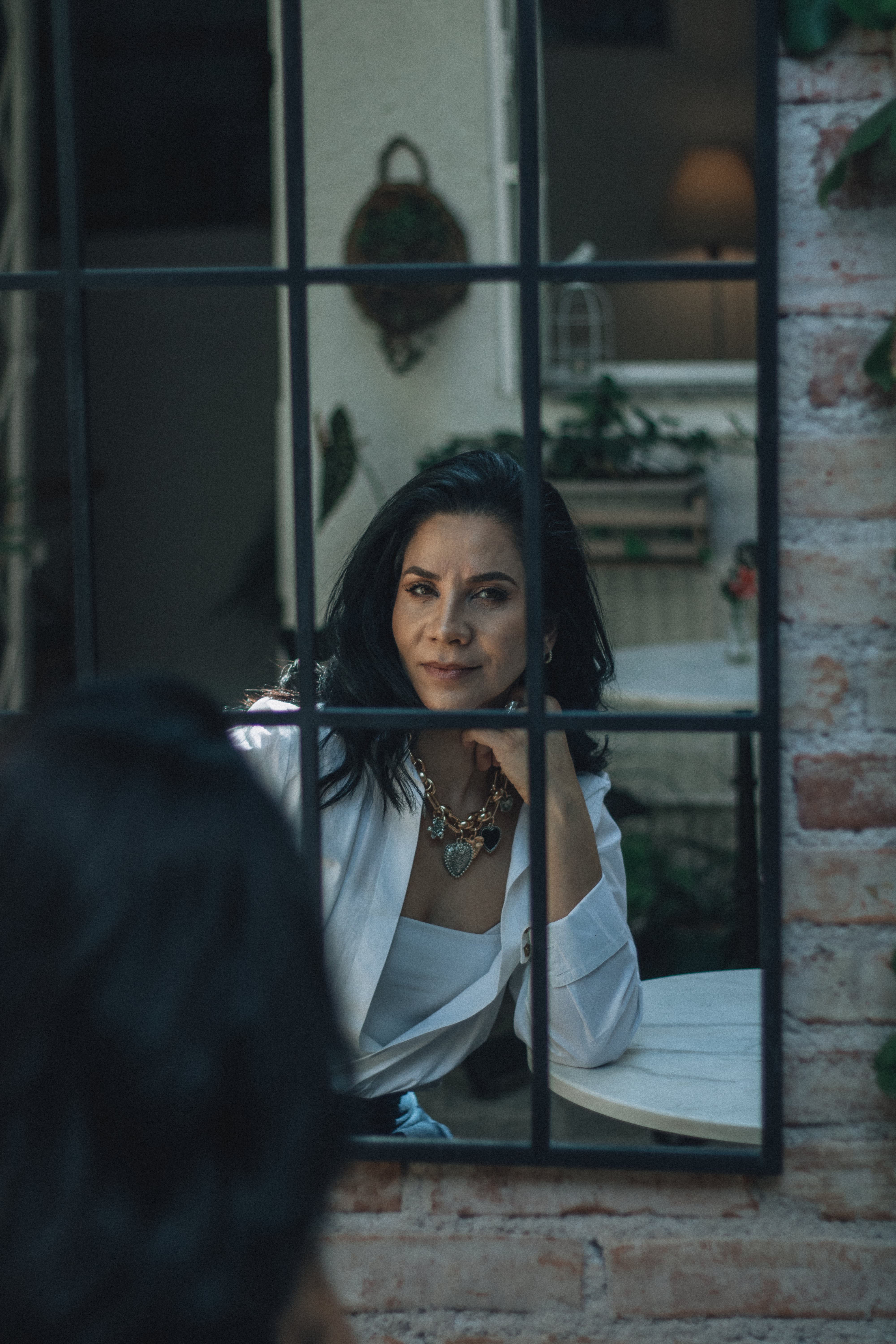 Elegant Woman Posing by Window in Modern Interior · Free Stock Photo