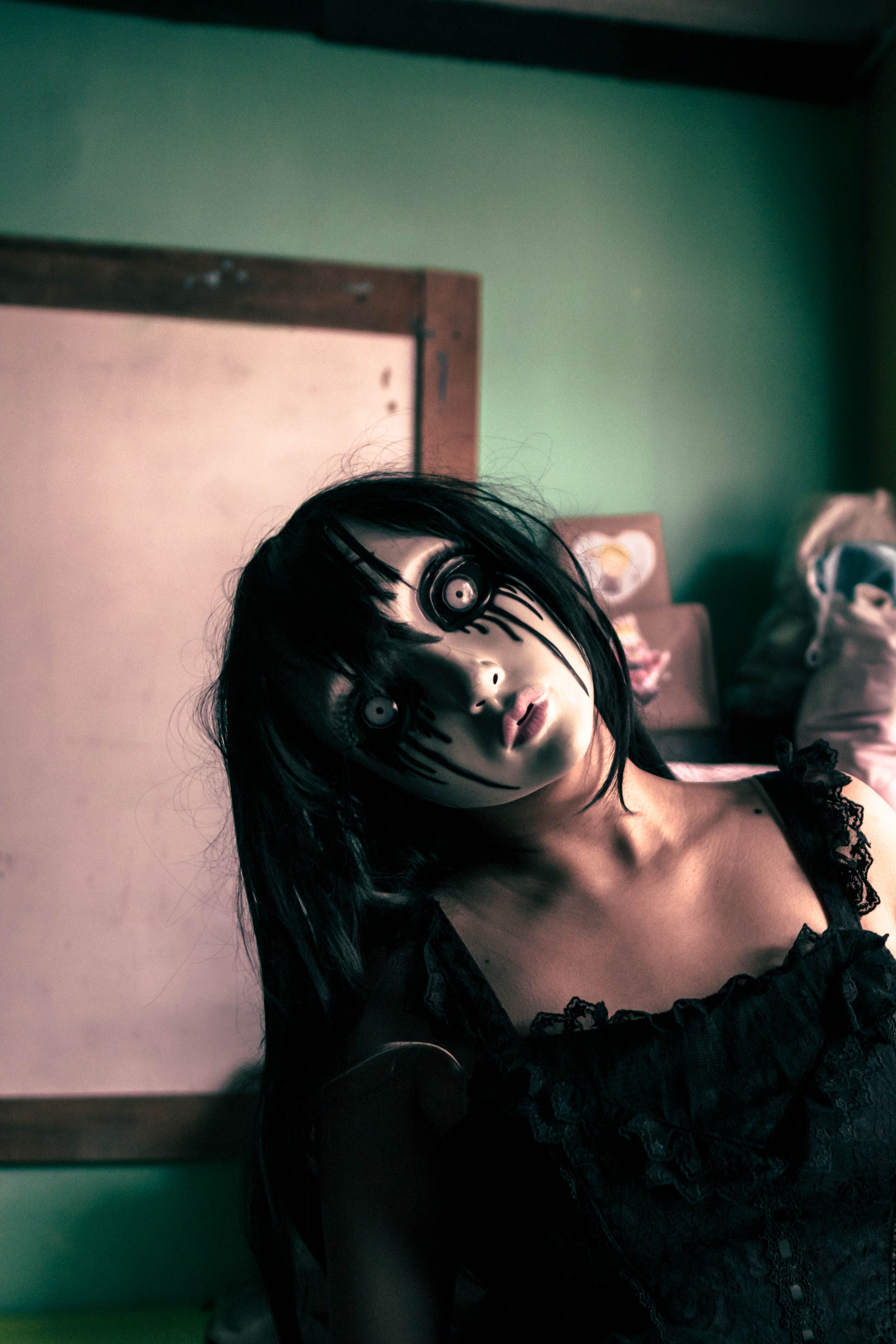 Eerie portrait of a person in a gothic Halloween costume with dark eye makeup indoors.. pexels, eerie, portrait