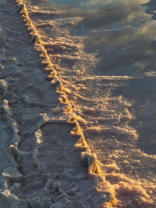 Free Beautiful golden light illuminating the salt formations along a lake in Victoria, Australia. Stock Photo