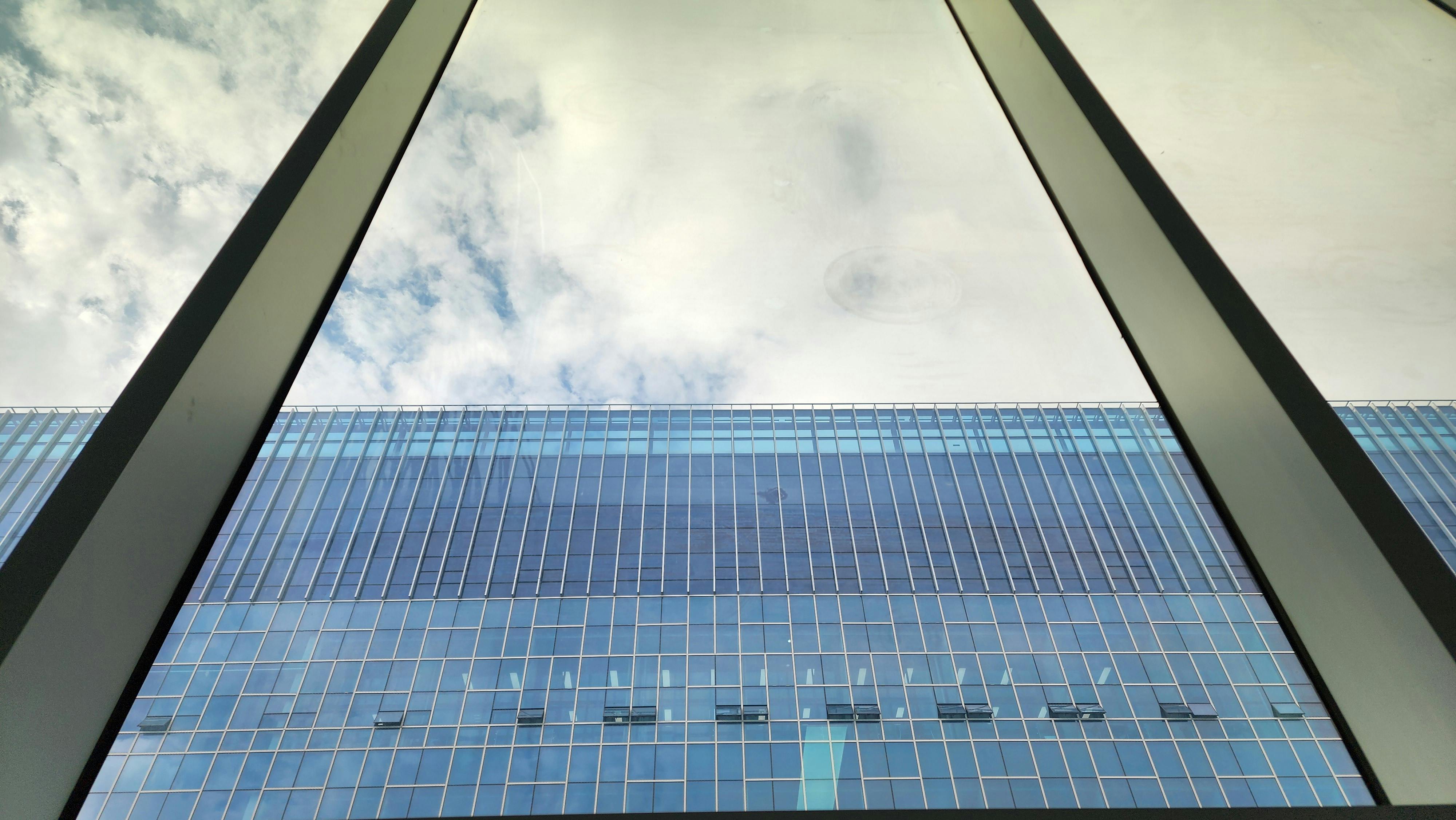 Captivating reflection of the sky in a modern glass building facade in Pyeongtaek City, South Korea.