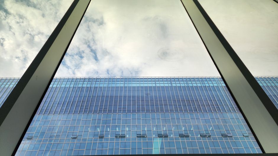 Captivating reflection of the sky in a modern glass building facade in Pyeongtaek City, South Korea.