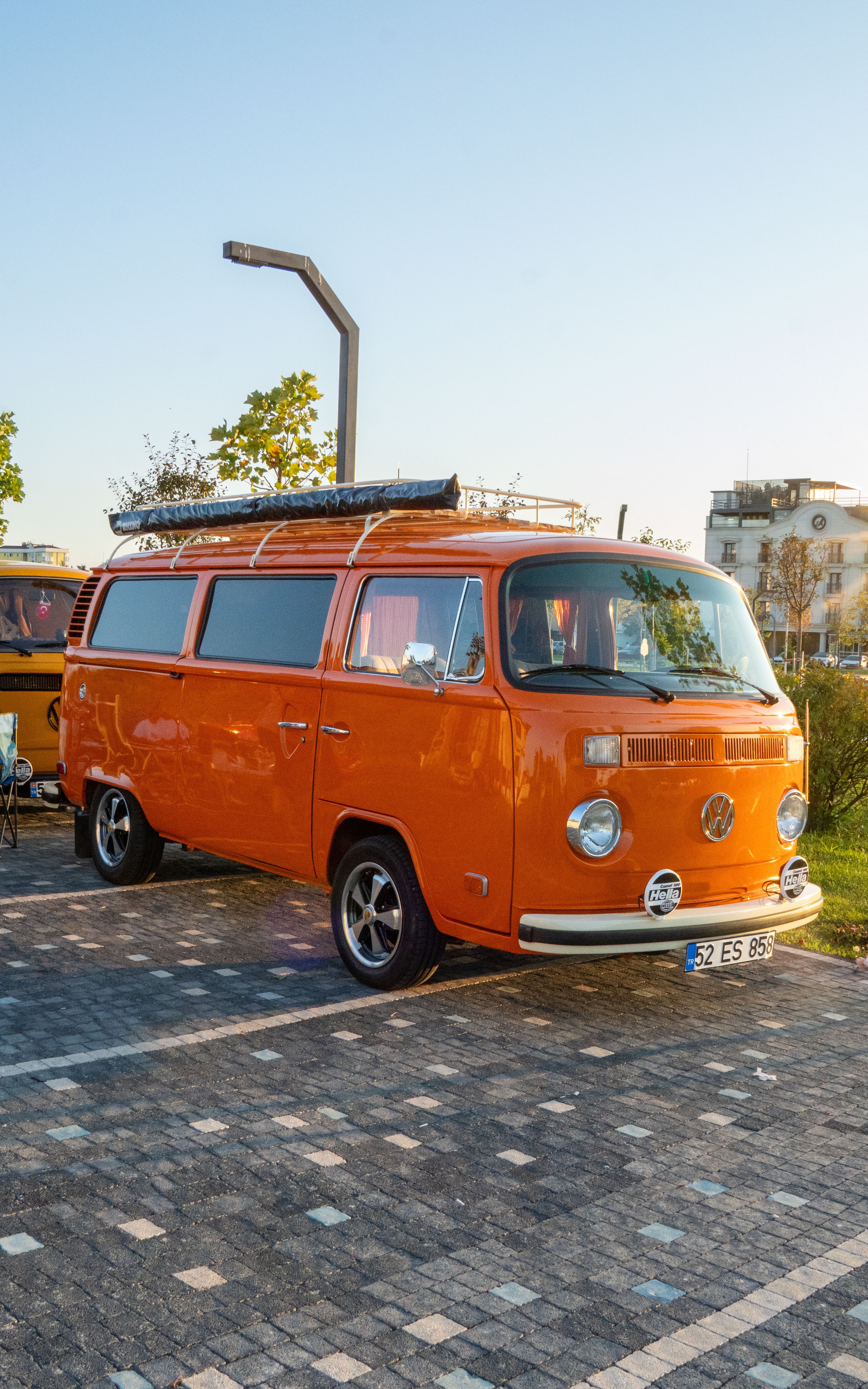 Vintage Orange Camper Van Parked Outdoors · Free Stock Photo