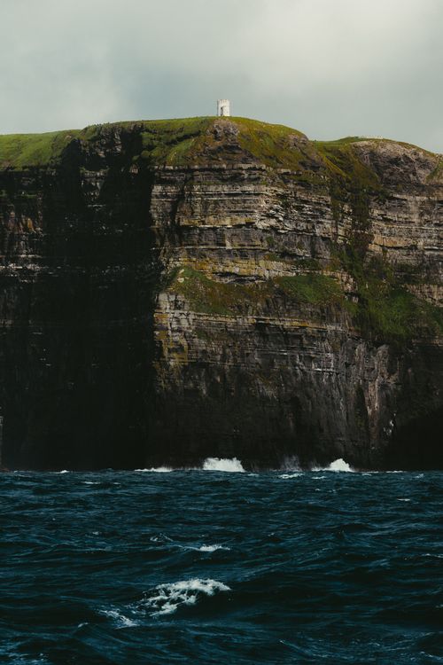 Free Dramatic cliffs of Inishmore, Ireland, with ocean waves crashing below. Stock Photo