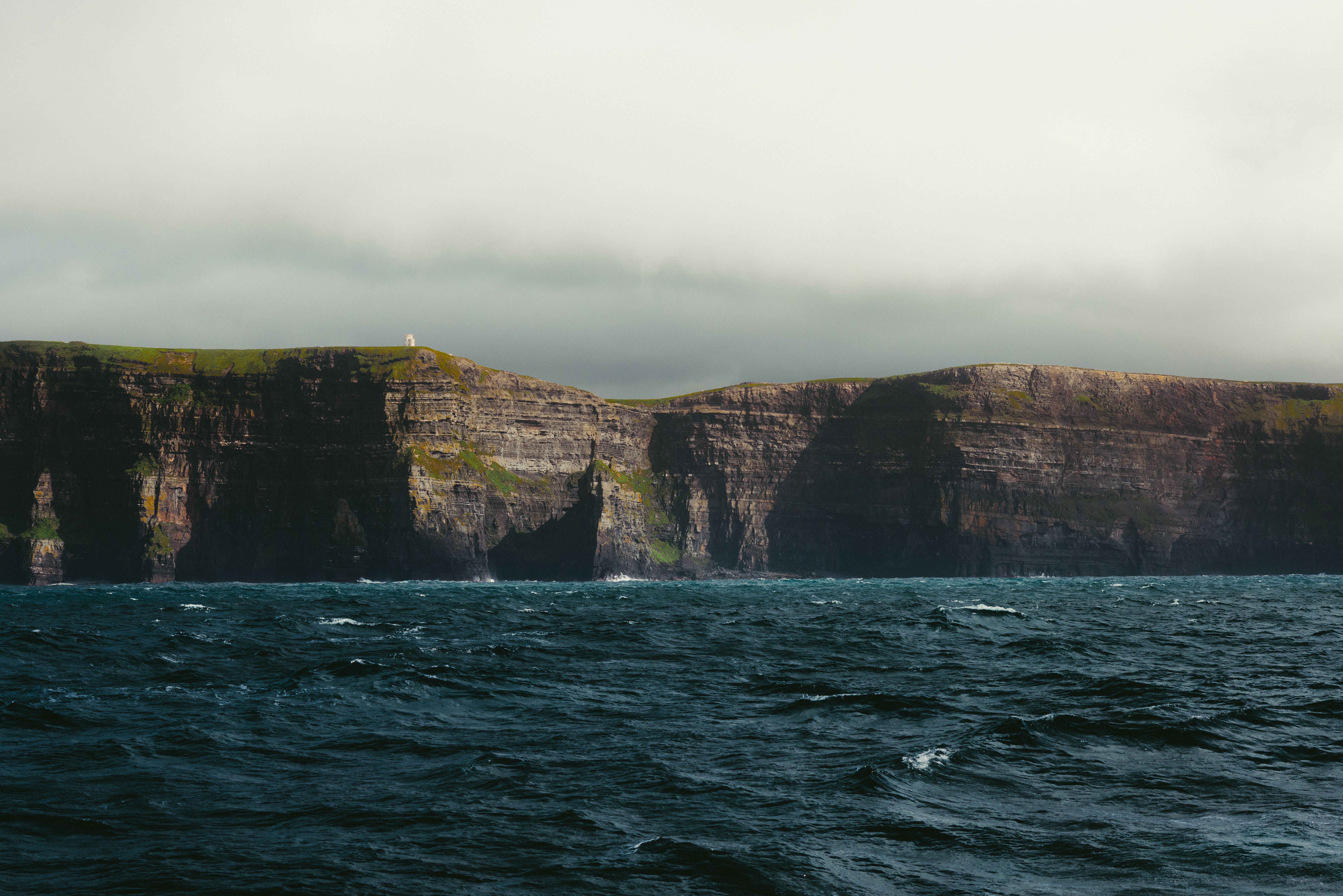 Dramatic coastline of the Wild Atlantic Way in Ireland during a passing rain shower