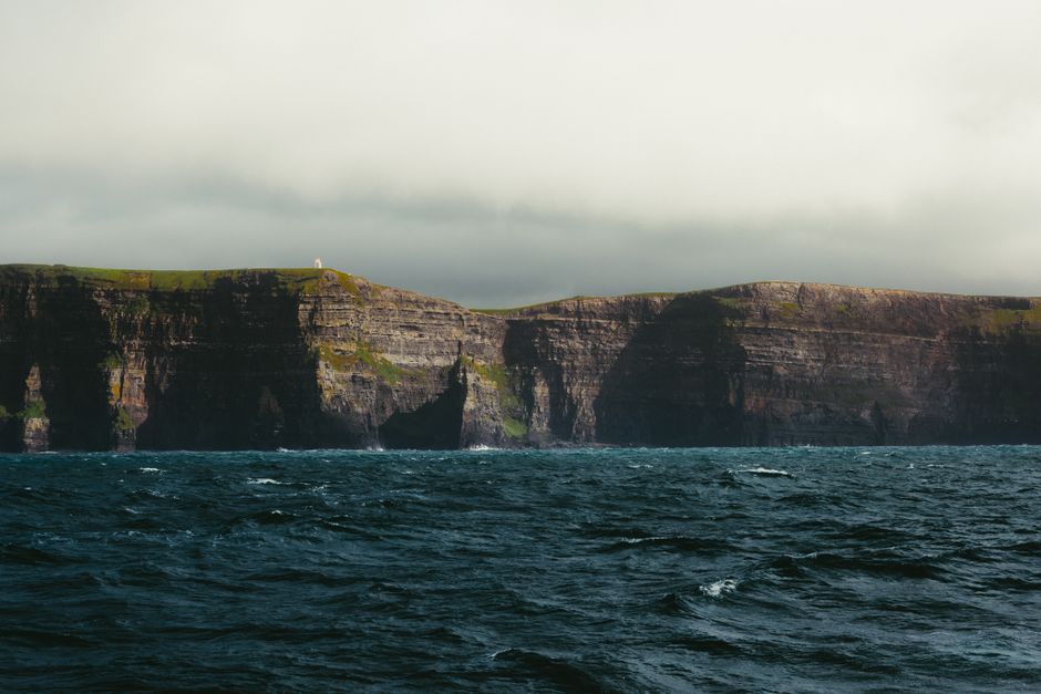 Dramatic coastline of the Wild Atlantic Way in Ireland during a passing rain shower