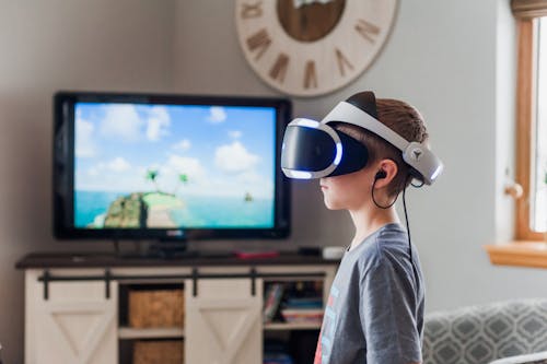 Free Boy Wearing a Black and White Virtual Reality Goggles Stock Photo