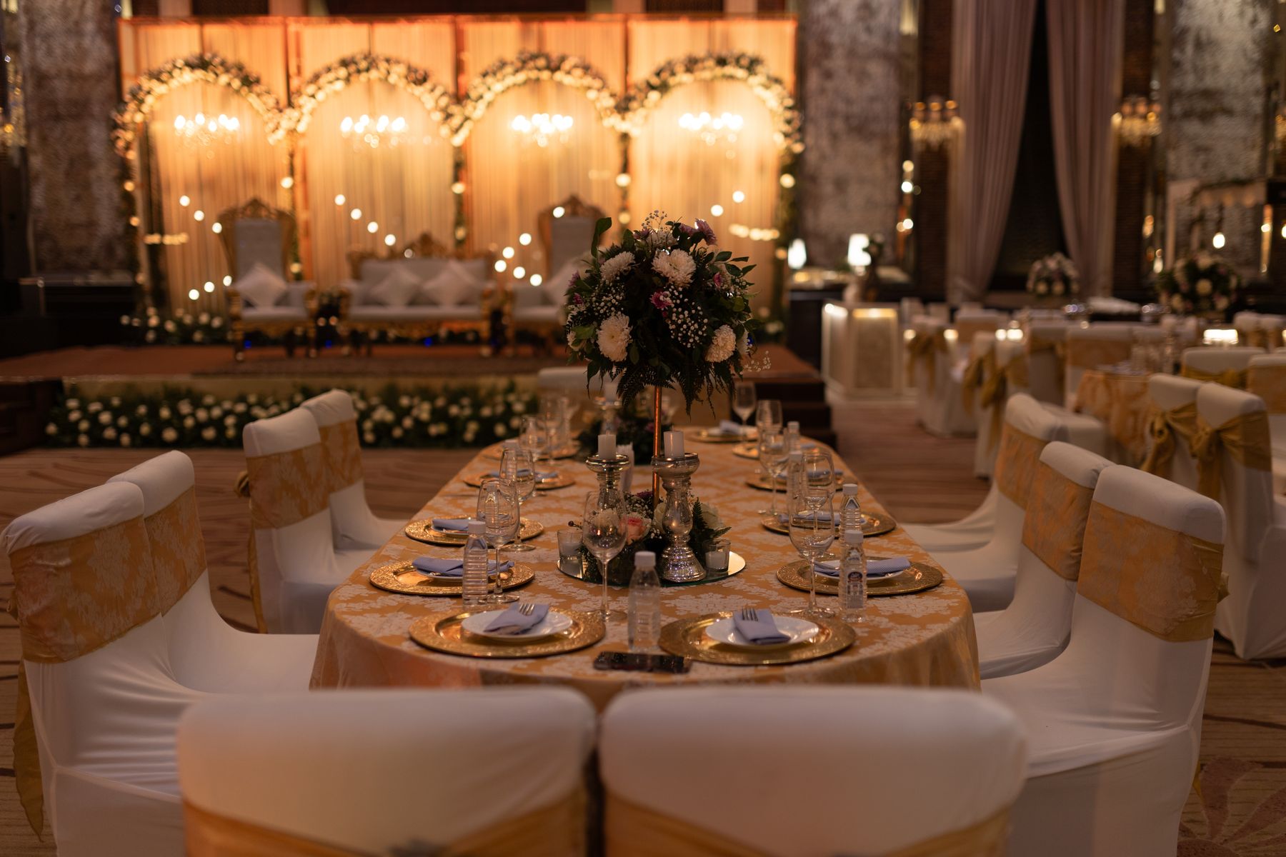 Elegant wedding reception venue with floral arrangements