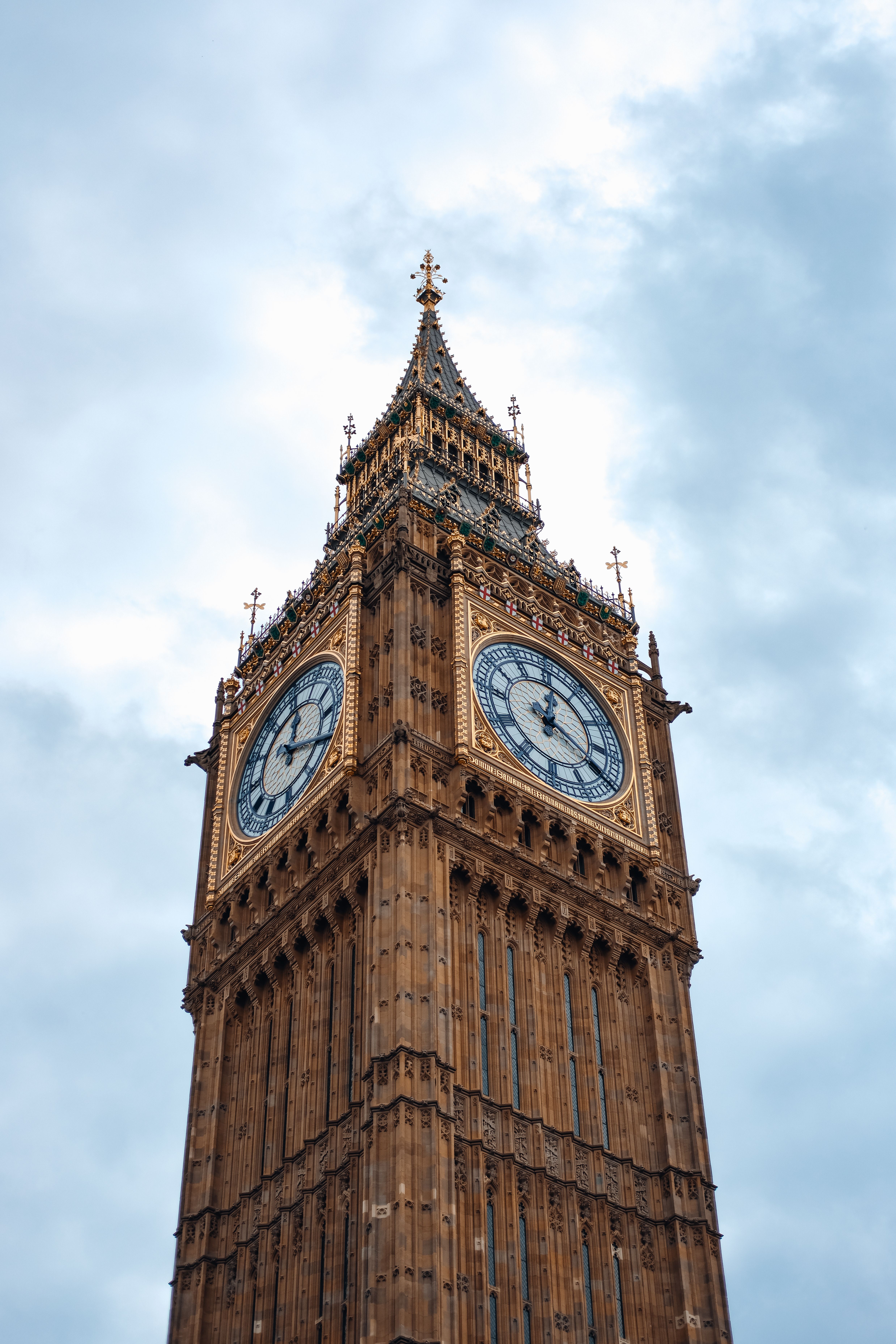 Iconic Big Ben Tower Against Cloudy Sky · Free Stock Photo