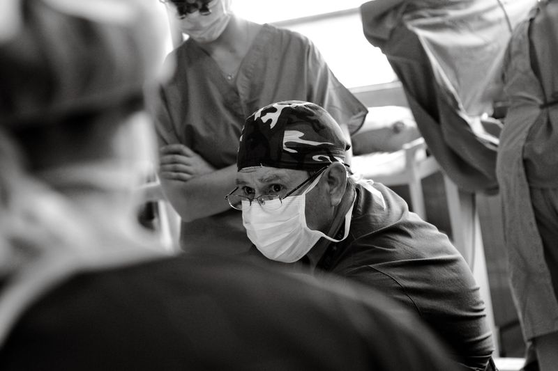 Surgeon concentrating on a procedure in a sterile operating room
