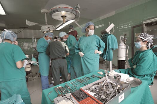 A diverse group of surgeons collaborates in a busy operating room, showcasing teamwork and medical precision.