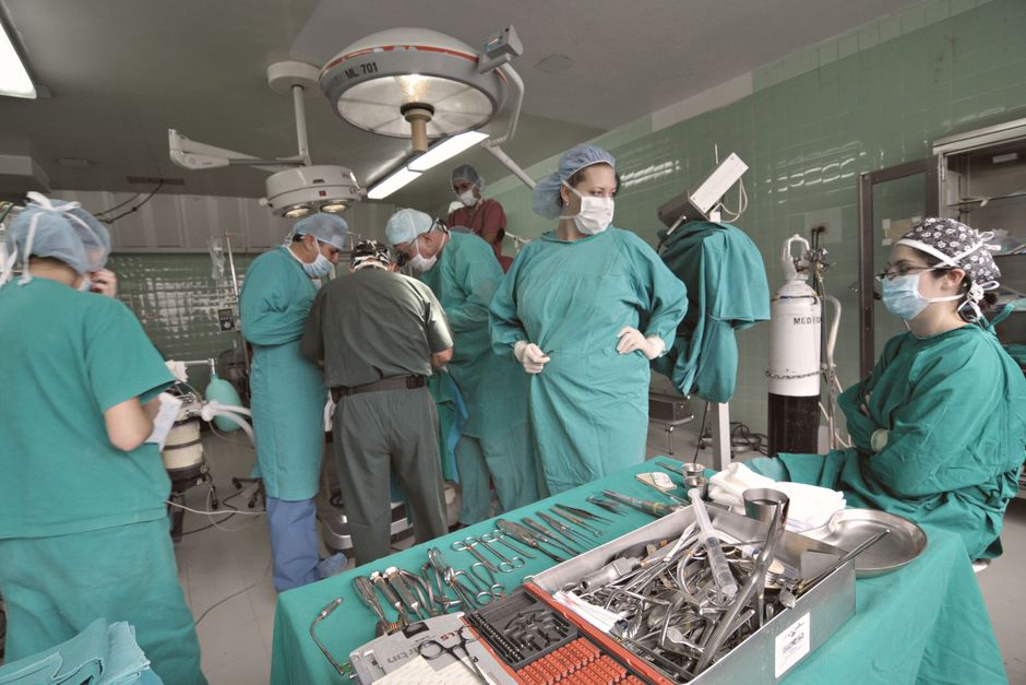 surgical team in a high-tech operating room - specialized medical treatments