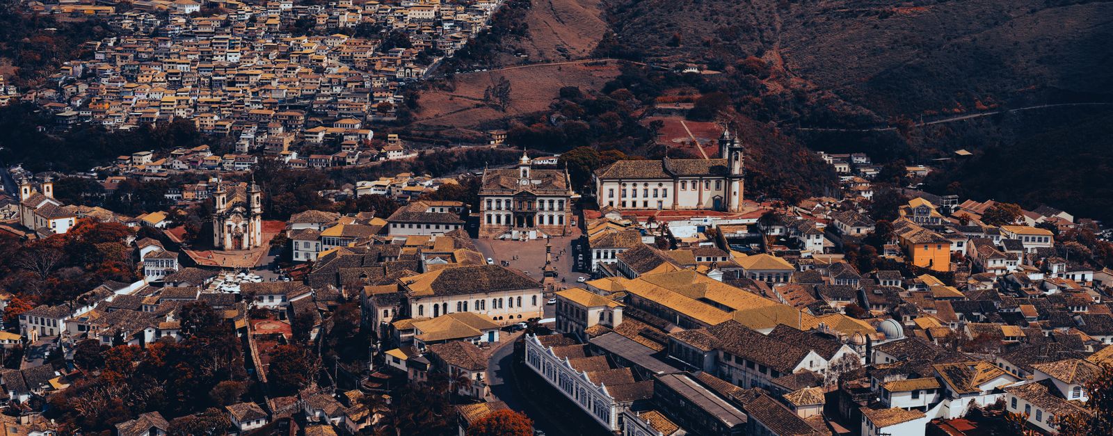 Stunning aerial view of Ouro Preto, Brazil, showcasing its historic architecture and mountainous landscape.