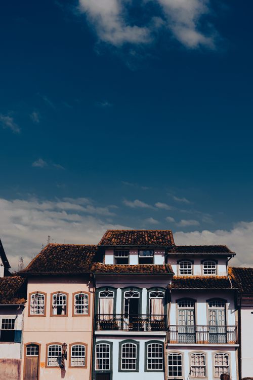 Free Charming colonial houses in Ouro Preto, Minas Gerais, Brazil, under a clear blue sky. Stock Photo