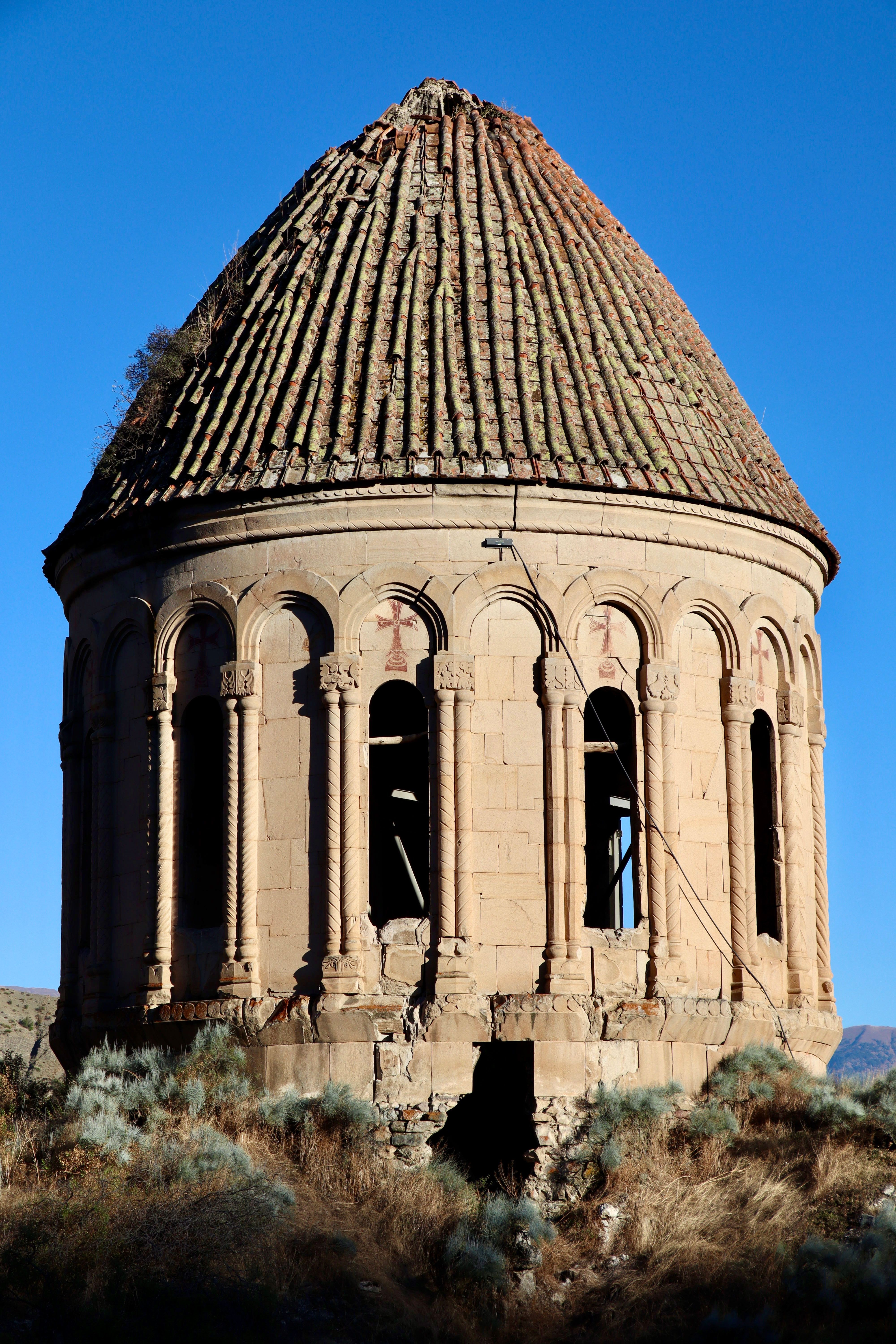 Ancient Armenian church architecture with distinct dome in Erzurum, Türkiye.