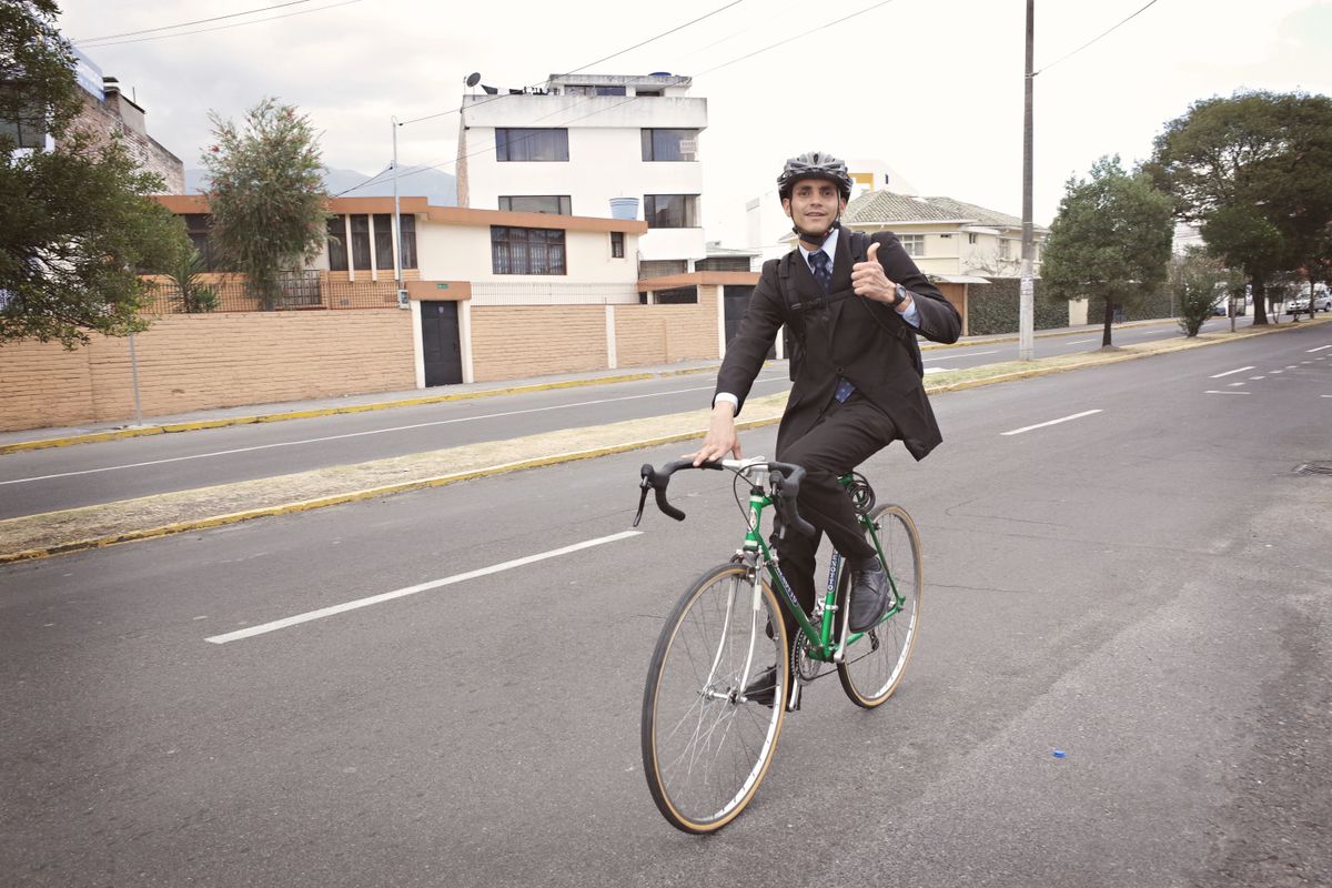 Helmeted cyclist commuting through a city