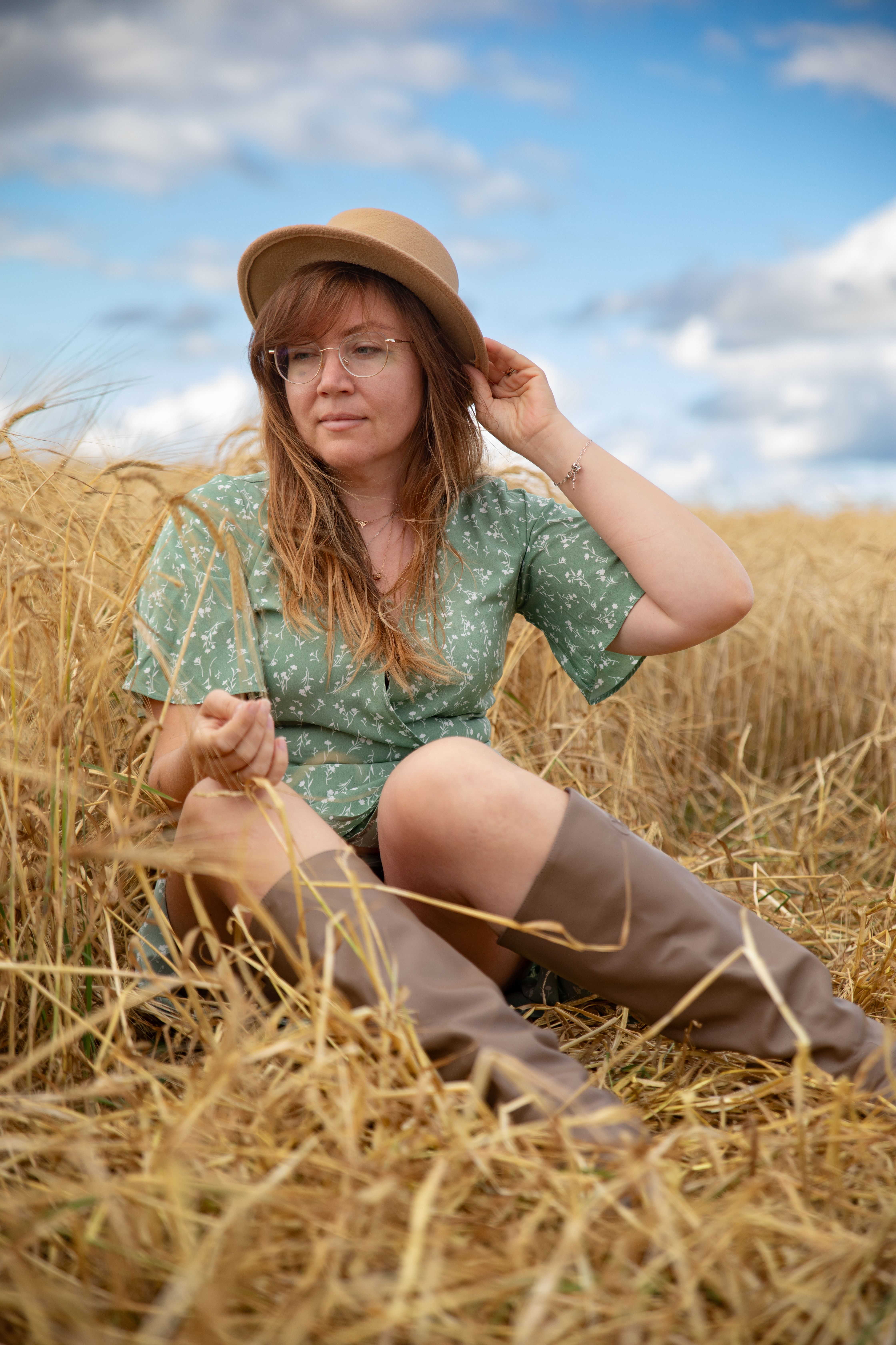Woman in Field with Hat and Green Dress  Free Stock Photo