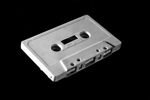 Monochrome photo of a vintage cassette tape evokes nostalgia and retro vibes.