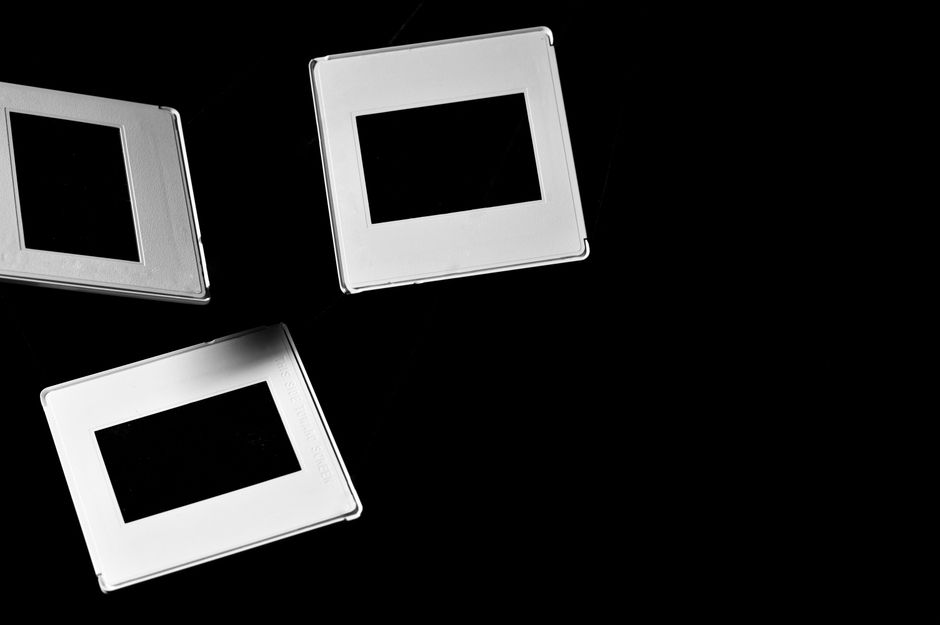 Artistic composition of metallic frames on a black background, showcasing minimalist design.