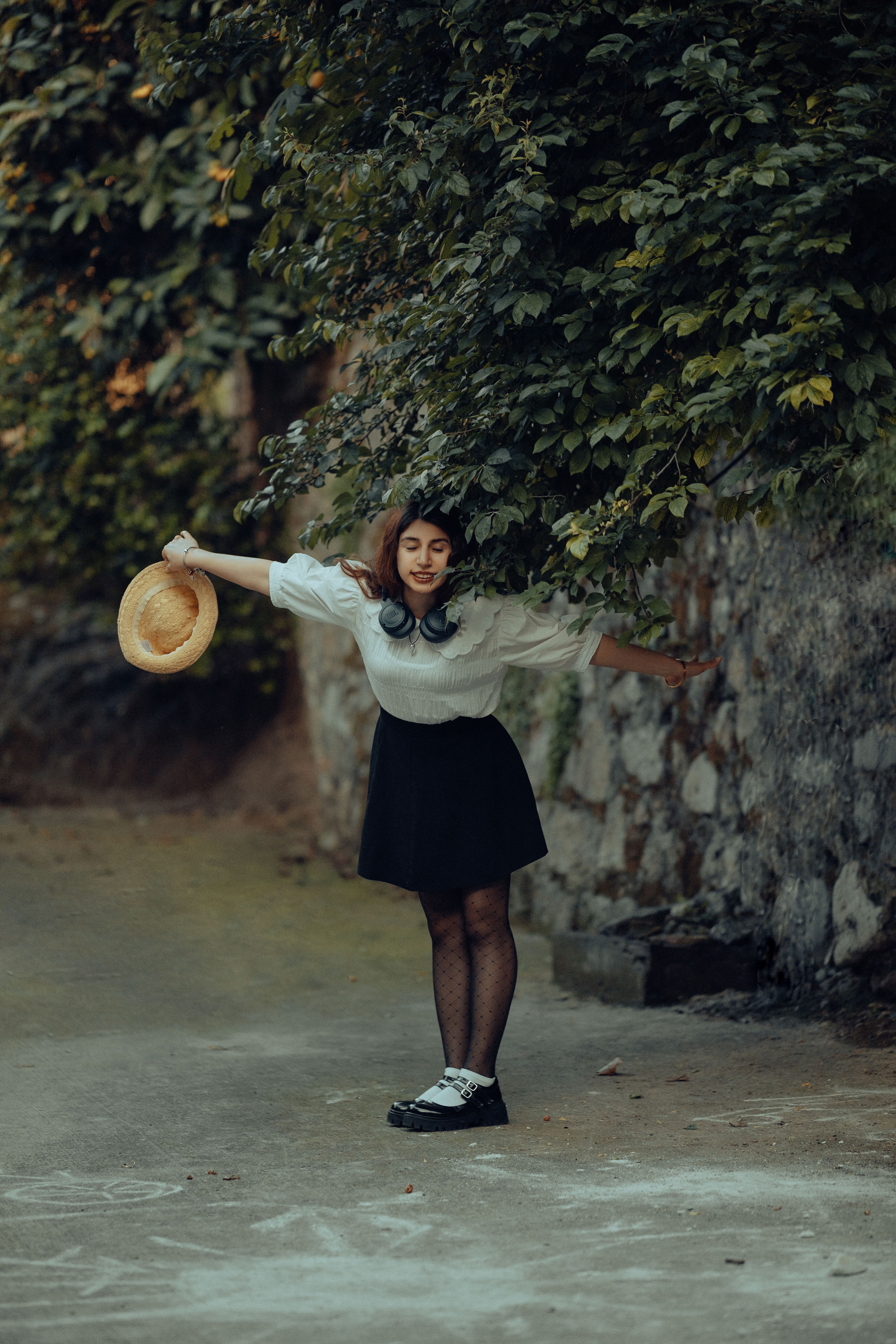 Young Woman Balancing in Nature with Hat · Free Stock Photo