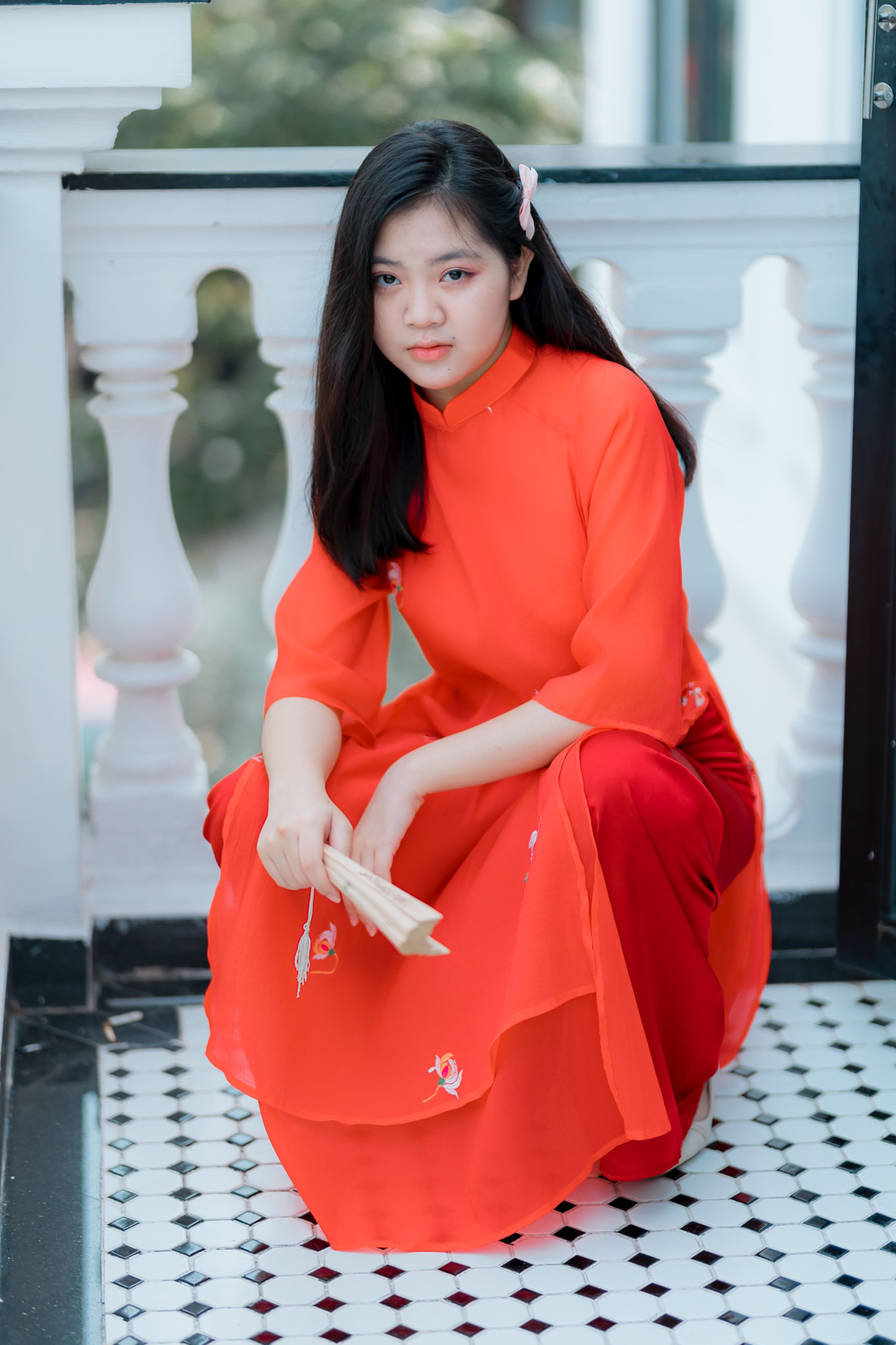 Young Woman in Traditional Red Dress with Fan · Free Stock Photo